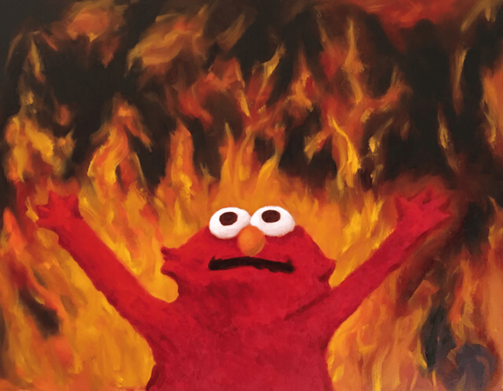 Elmo with flames in the background.